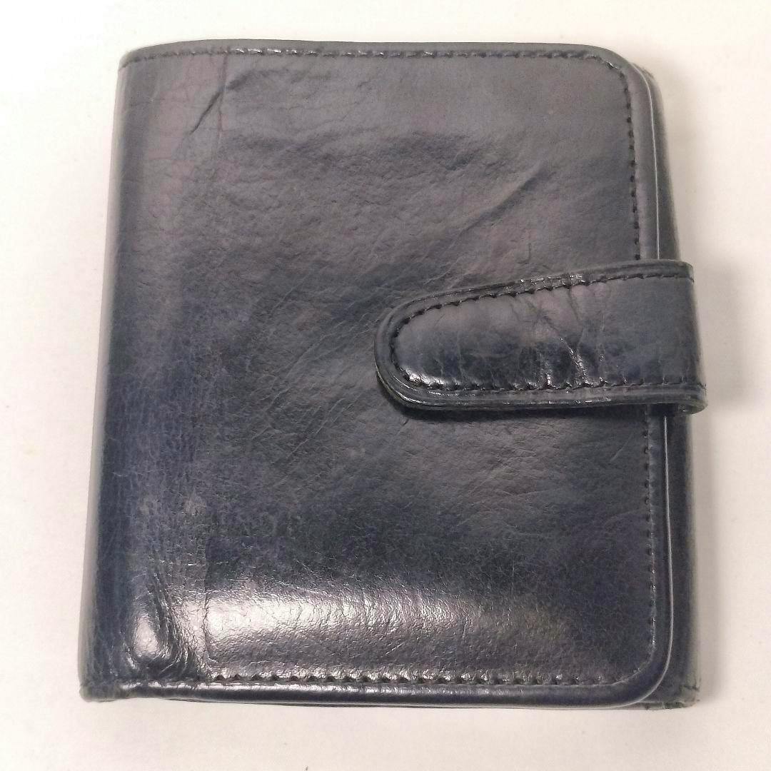 Black Coach two-fold leather wallet shown closed with an outer strap.
