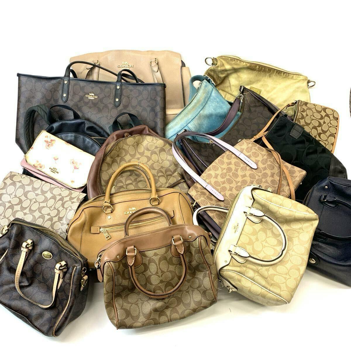 Multiple COACH handbags, totes, and shoulder bags arranged together on a white background.