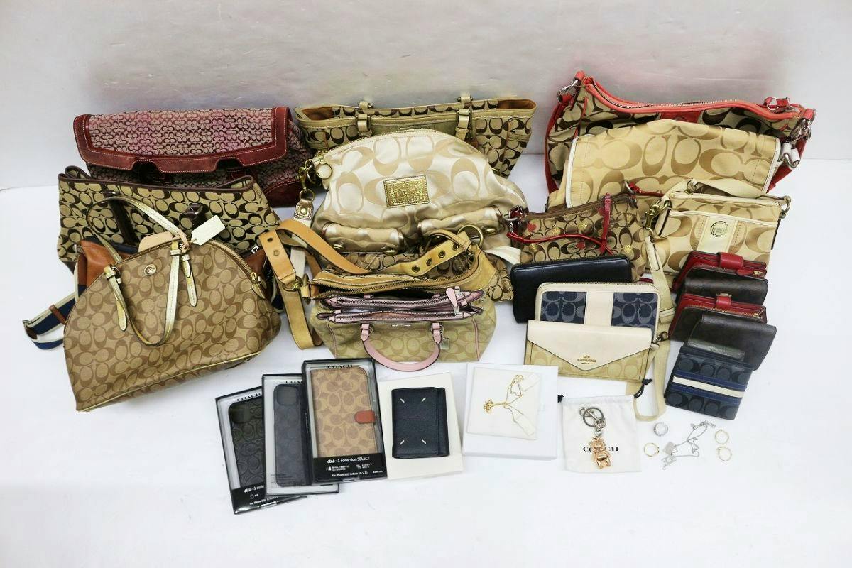 Multiple bags, wallets, phone cases, and small accessories arranged on a white background as a bulk lot.