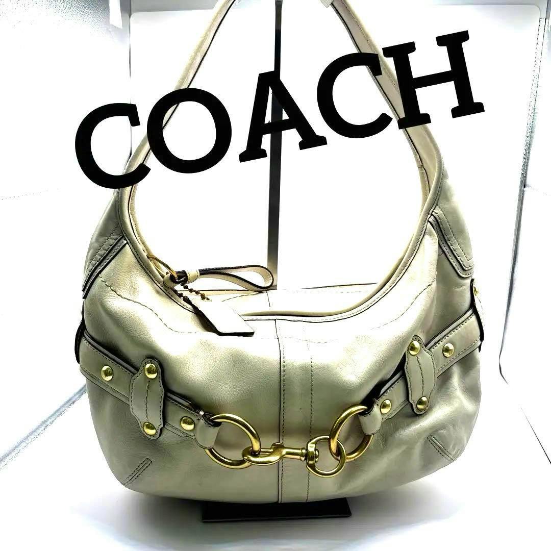 Front view of the white-toned COACH Ergo hobo shoulder bag in cow leather showing gold-tone horsebit hardware.
