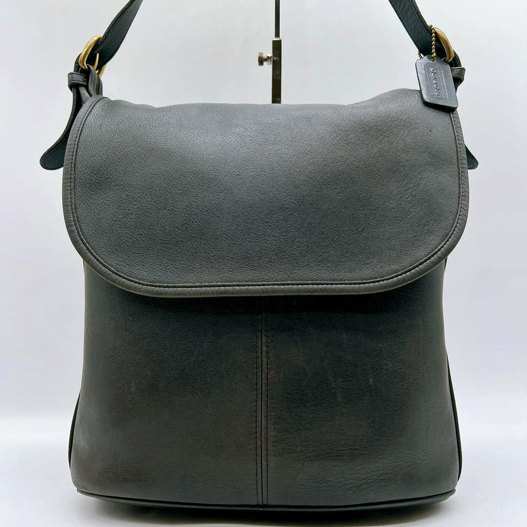 Front view of the COACH gray flap shoulder bag in glove-tanned cow leather against a white background.