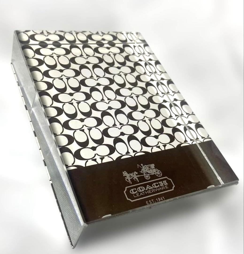 Front view of a Coach photo frame showing the signature 'C' pattern and the Coach Leatherware logo on the lower front.