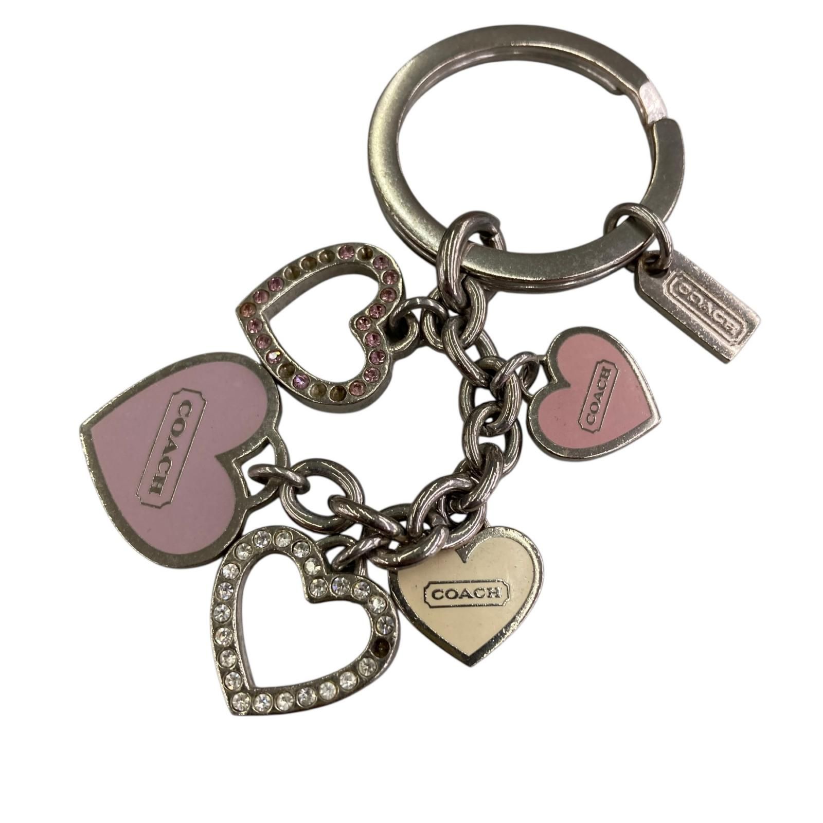 Pink Coach heart-motif bag charm key holder with multiple heart pendants and a key ring, zinc alloy.
