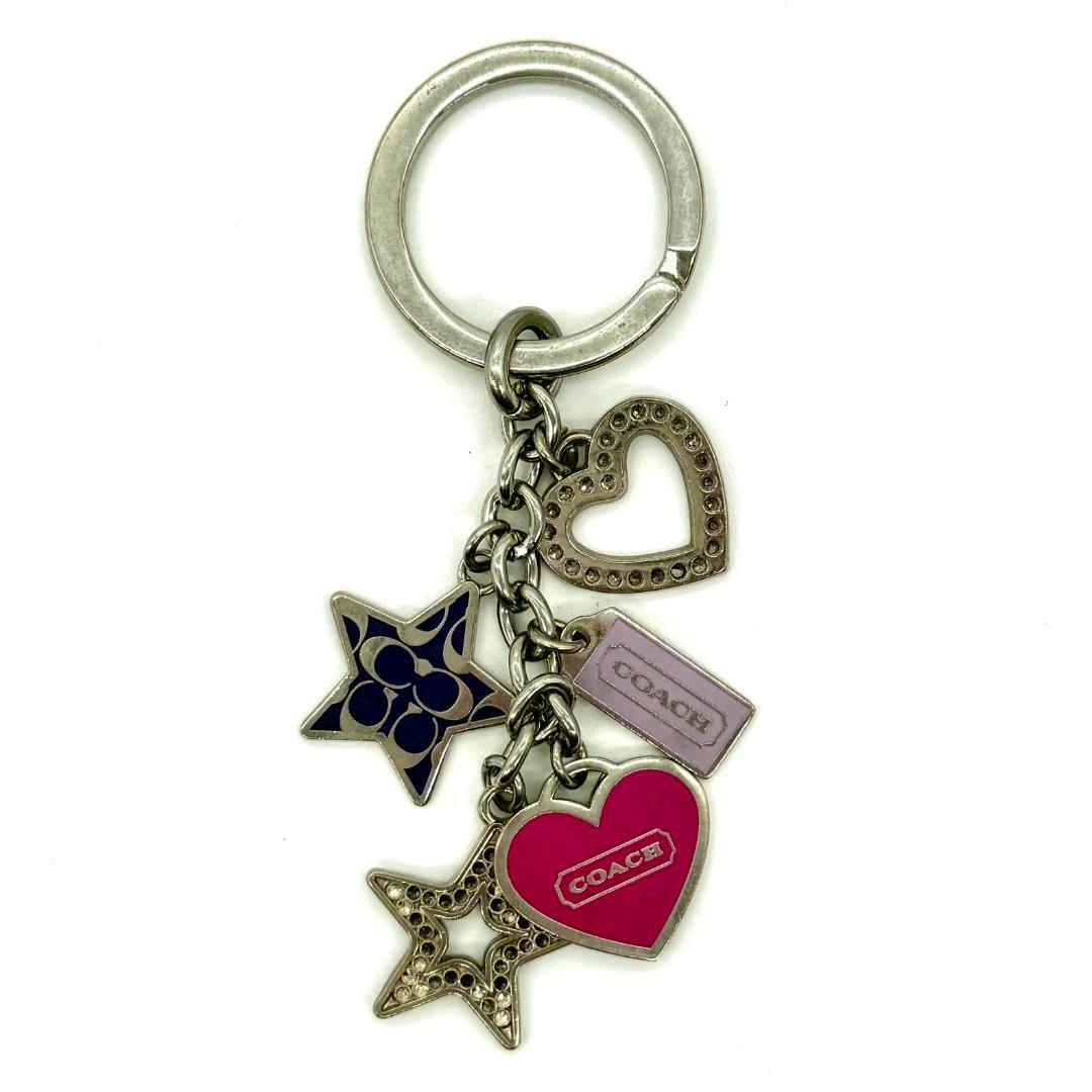 Front view of the Coach heart and star motif zinc alloy key ring showing multiple heart and star charms on a white background.