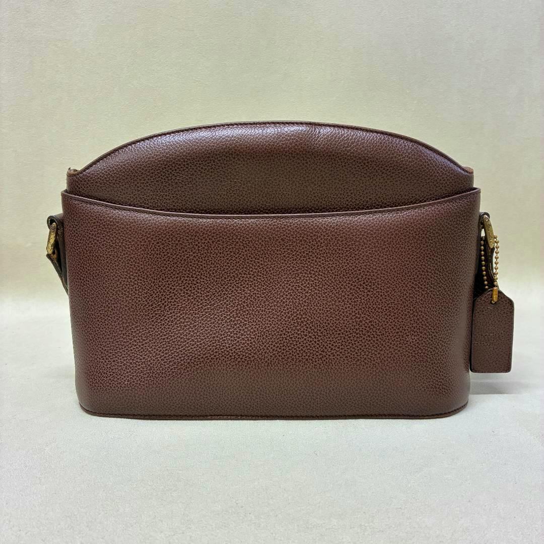 Brown pebbled leather COACH Madison shoulder bag shown on a neutral background.