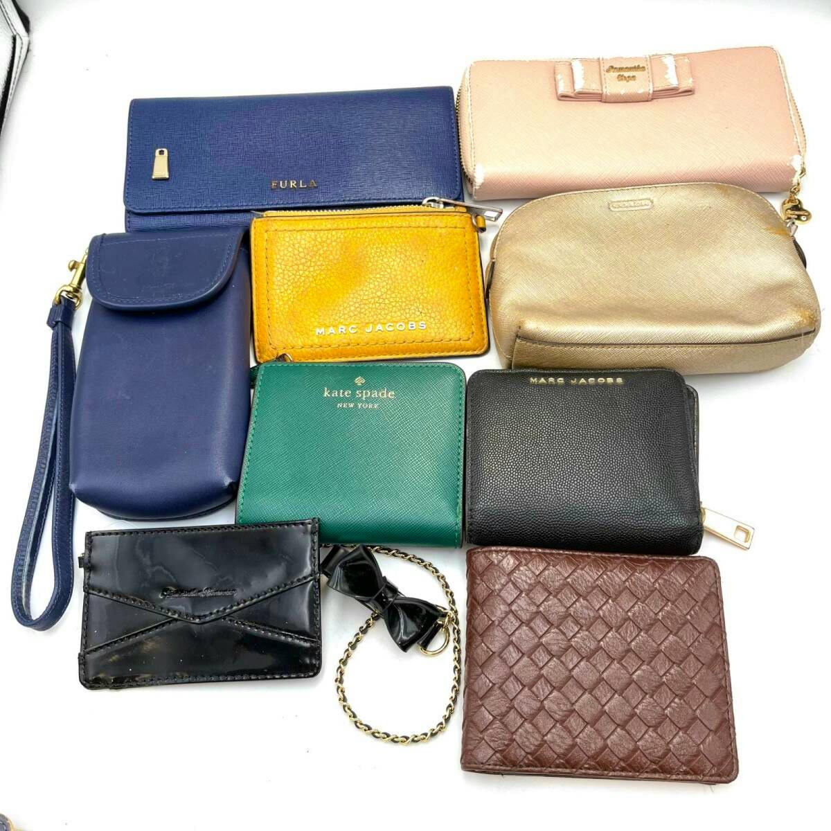 Multiple wallets, pass cases, and pouches from various brands arranged on a white background.