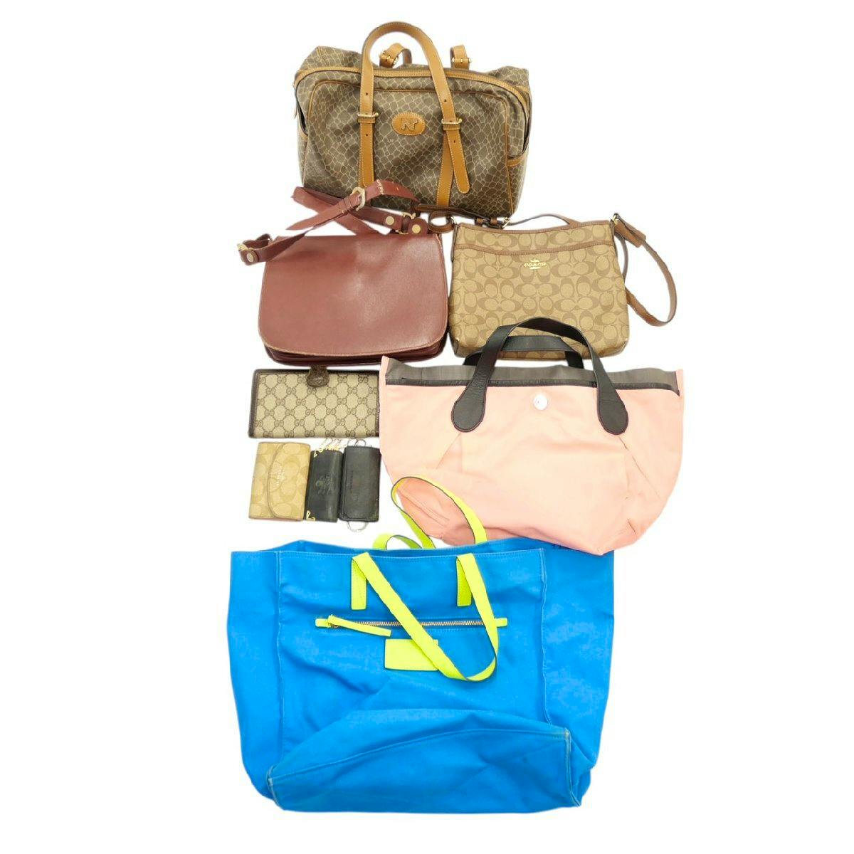 Several women's bags and small leather accessories (wallets, handbags, key case) arranged on a white background.