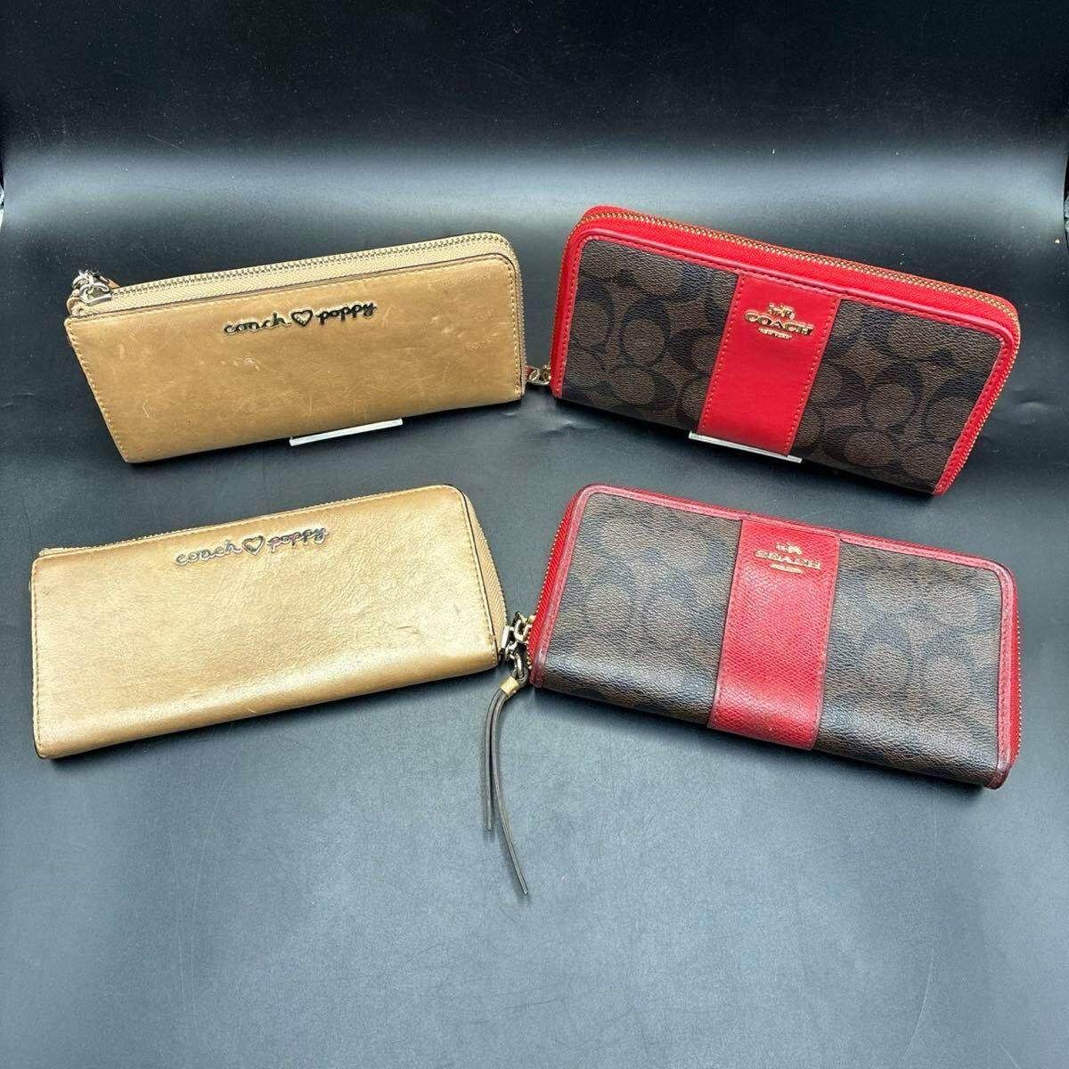 Four COACH zip-around long wallets (two brown signature canvas with red trim and two tan "Coach Poppy" wallets) displayed on a black background.