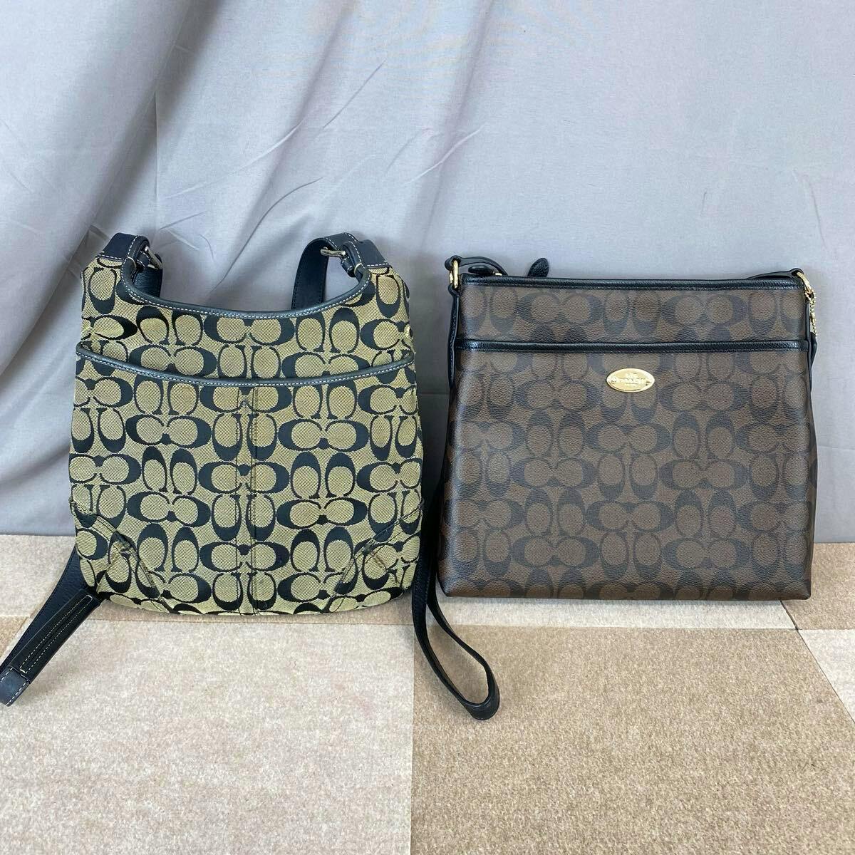 Two COACH shoulder bags with signature C canvas and leather trim, a beige/black bag on the left and a brown bag on the right.