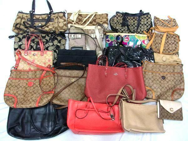 Group of Coach tote, shoulder, and handbag styles arranged together on a white surface.