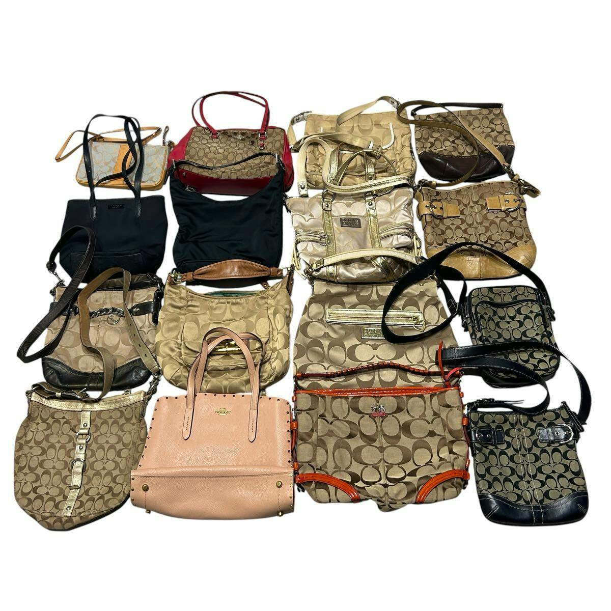 Top-down photo of many Coach signature canvas and leather bags arranged together as a bulk set.