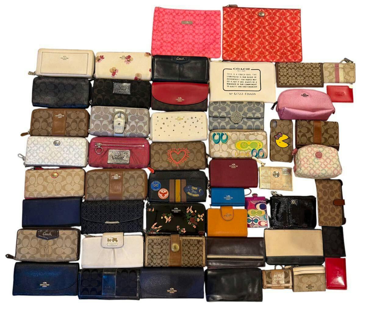 A grid of assorted Coach wallets and small pouches arranged together to show a bulk set of items.