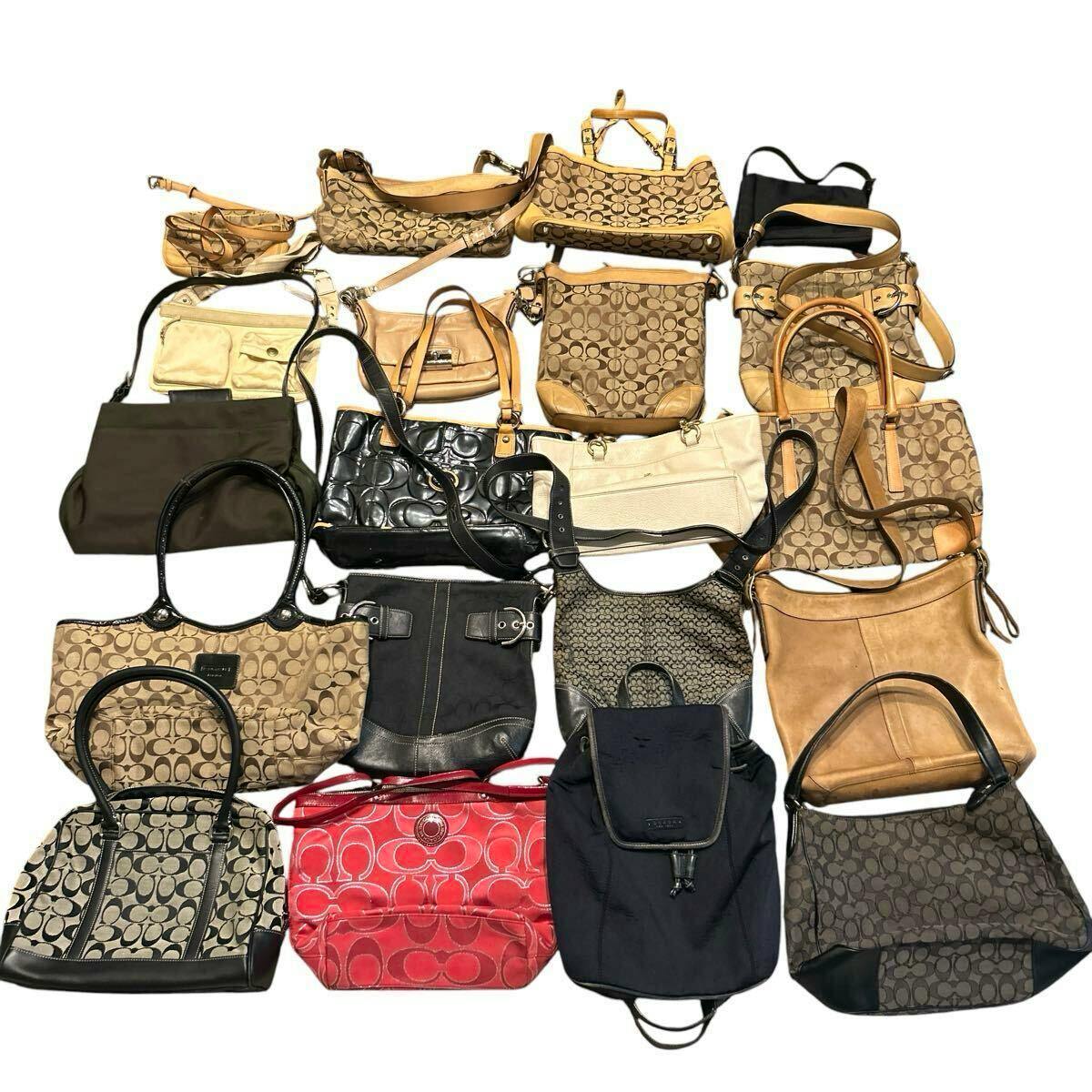 A group of COACH bags and purses arranged together on a white background.