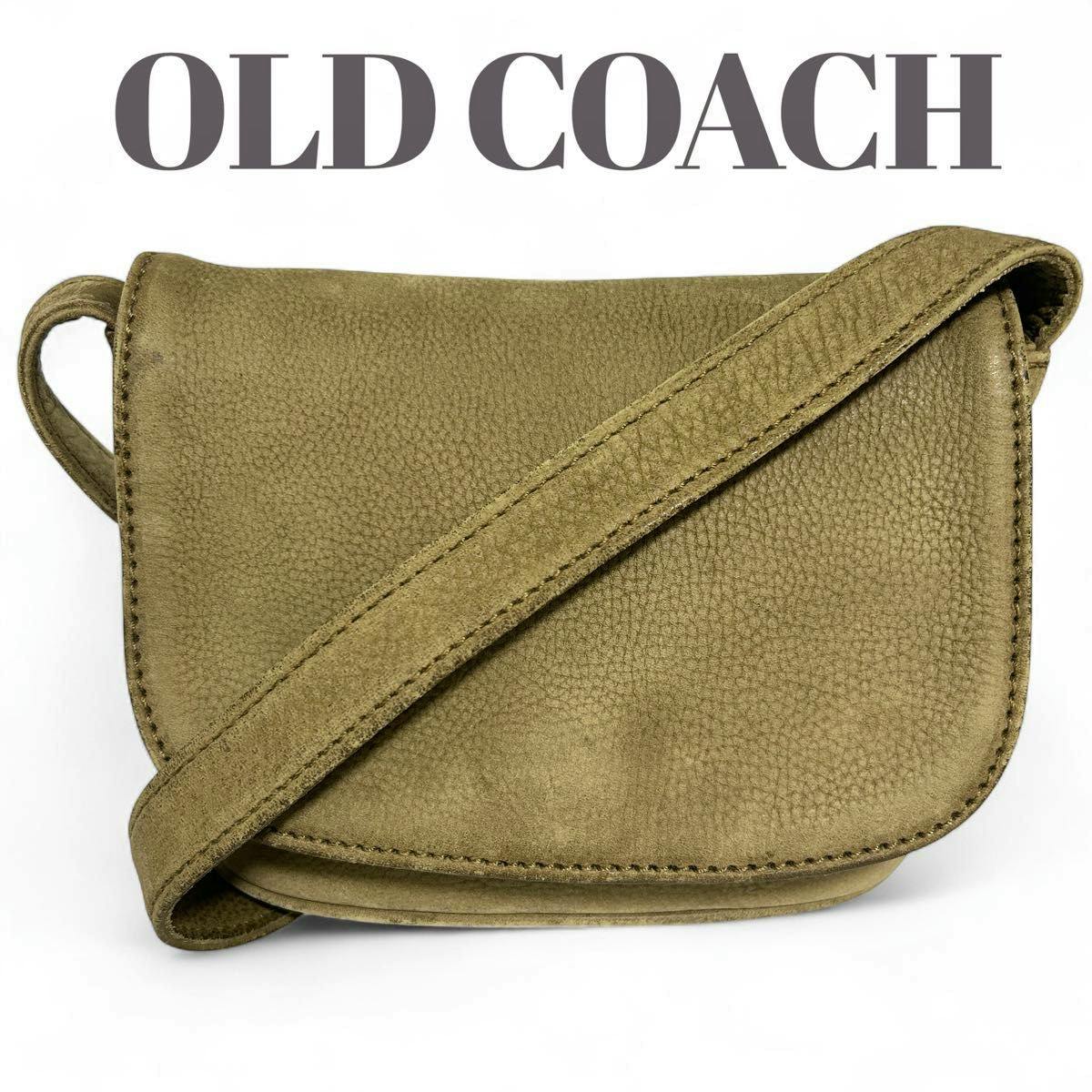 Front view of the COACH vintage nubuck cow leather flap shoulder bag with its strap shown diagonally across the front.