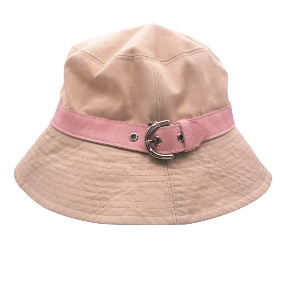 Light beige cotton COACH bucket hat with a pink leather belt and silver buckle.