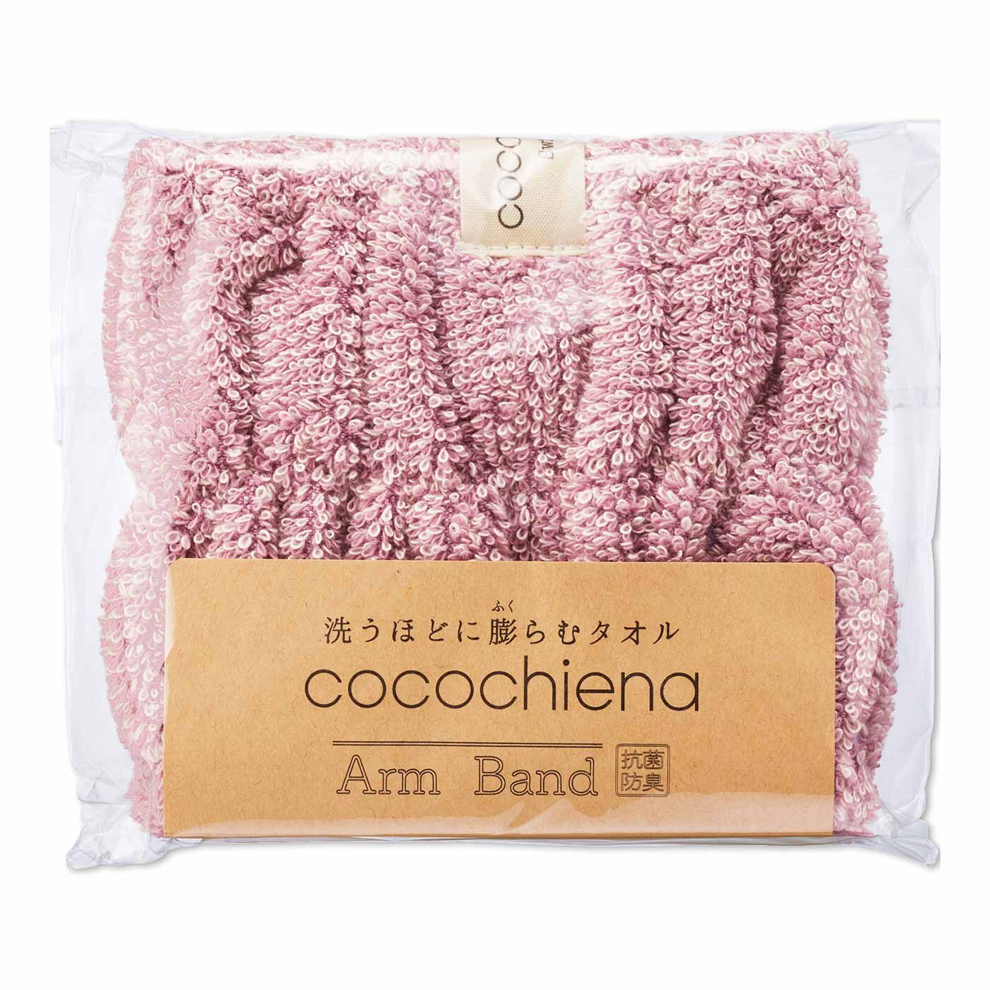 A packaged pink cotton arm band in clear plastic with a paper label reading "cocochiena Arm Band".