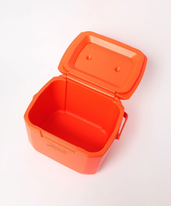 Orange Coleman Excursion 16QT plastic cooler box with the lid open showing the empty interior.