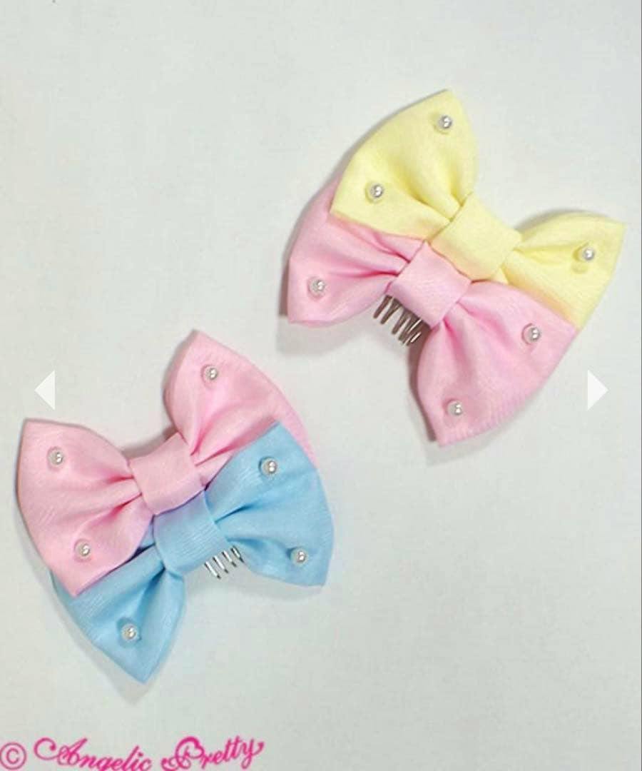 Two colorful twin-comb hair clips in pastel yellow, pink, and blue with pearl decorations on a white background.
