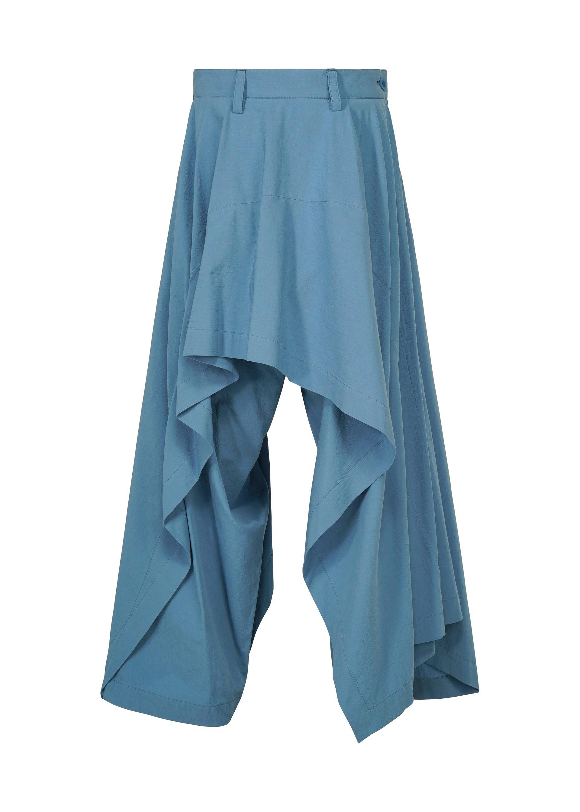 Blue cotton women's pants with a wide waistband and draped layered panels visible from the front.