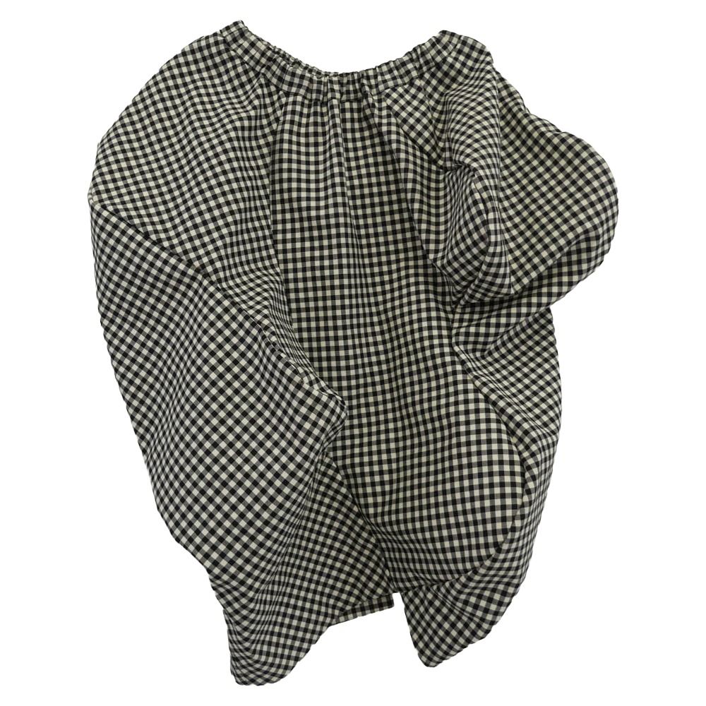 Black-and-white gingham wool women’s skirt laid flat showing gathered waistband and overall pattern.