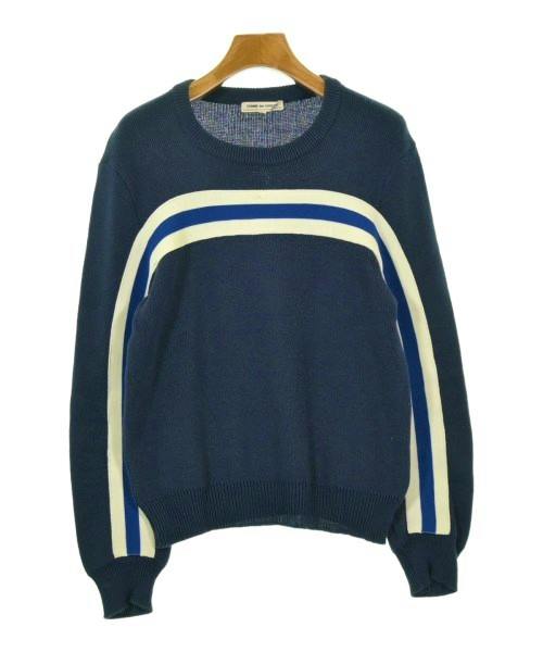 Front view of a navy COMME des GARCONS acrylic sweater with cream and blue stripes hanging on a wooden hanger.