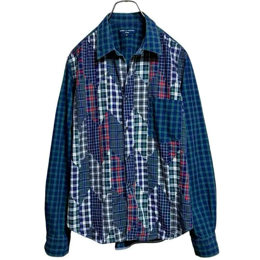 Front view of a men's patchwork long-sleeve check shirt on a hanger.