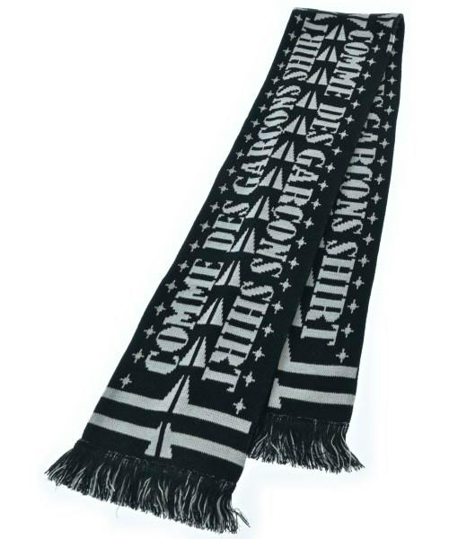 Black-and-white COMME des GARCONS SHIRT acrylic scarf with logo text and fringed ends.