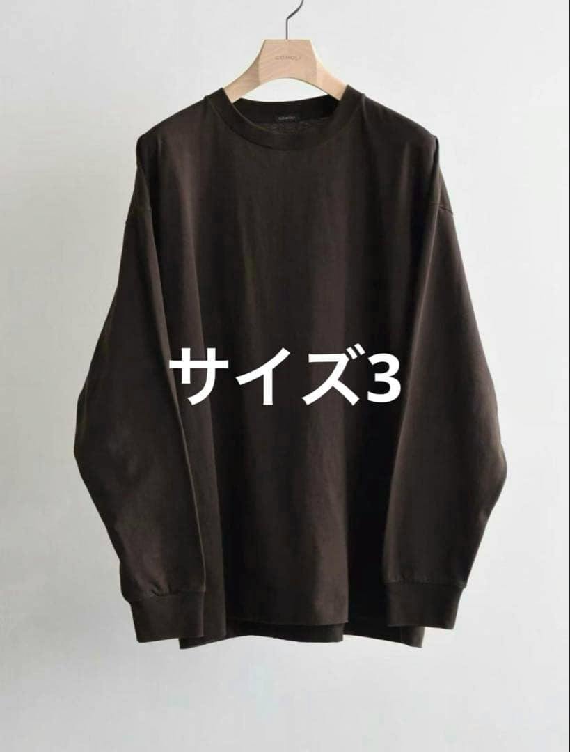 Brown long-sleeve cotton T-shirt on a hanger with overlaid Japanese text indicating size 3.