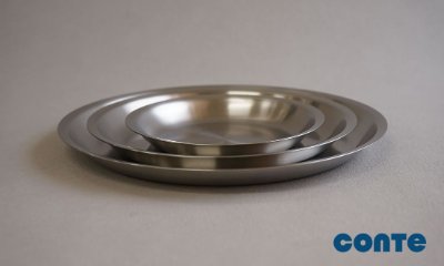 Three nested stainless steel round trays shown on a neutral surface with a conte logo.