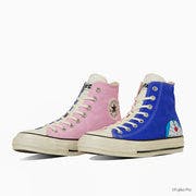 A pair of high-top canvas sneakers, one pink and one blue, shown side by side with Doraemon graphics.