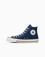 A navy blue high-top canvas sneaker with white rubber sole and an All Star ankle patch on a white background.