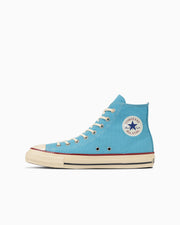 Side view of a blue high-top canvas sneaker (All Star Aged TC Hi) on a white background.