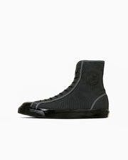 Black high-top canvas wrestling-style sneaker shown at a three-quarter angle on a white background.