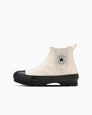 Side profile of the All Star Chunk WC Sidegore Hi canvas sneaker in light cream with a black chunky sole and visible side logo patch.