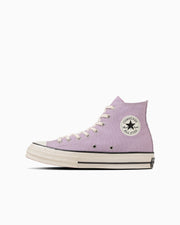 Side profile of a light purple high-top canvas sneaker on a white background.