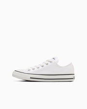 Side view of a white canvas All Star Ox low-top sneaker on a white background.