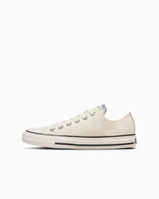 Side view of an ALL STAR PM OX white canvas low-top sneaker on a white background.
