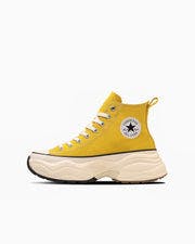 Yellow high-top canvas sneaker (ALL STAR SURGETRAINER HI) shown in profile with a chunky cream sole and white laces on a white background.