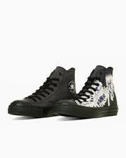 Pair of high-top canvas sneakers, one solid black and the other with a black-and-white ukiyoe print, on a white background.