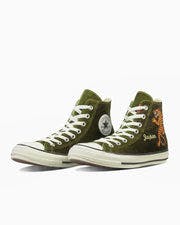 Pair of olive-green high-top canvas sneakers shown from a front-side angle on a white background.