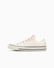 Side profile of a white canvas low-top All Star sneaker on a plain white background.