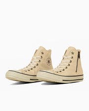Beige canvas All Star Starzip Hi high-top sneakers shown at a three-quarter angle on a white background.