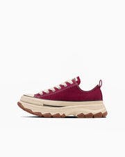 Side view of a single canvas sneaker (ALL STAR TREKWAVE FS OX) in dark red with a chunky tan sole on a white background.