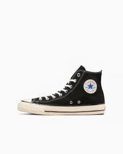 Black high-top canvas sneaker shown in profile with white rubber sole and All Star ankle patch.