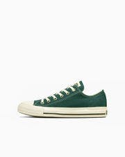 Side profile of an ALL STAR WASHEDCANVAS OX green low-top canvas sneaker with white rubber toe cap and sole.