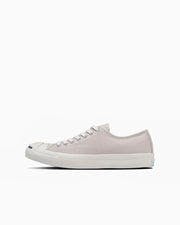 Side profile of a light-colored Jack Purcell canvas sneaker on a white background.