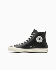 Black leather high-top sneaker shown in side view on a white background, displaying the All Star ankle patch and white sole.