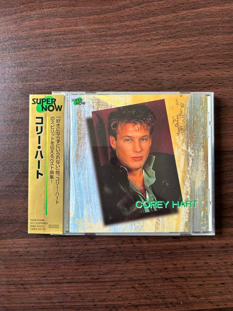A Corey Hart CD jewel case showing the album cover and a Japanese obi strip on a wooden surface.
