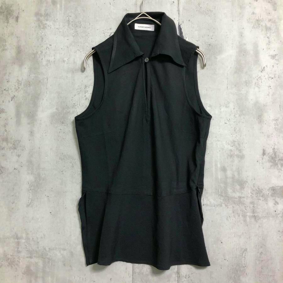 Black sleeveless women's blouse with a collar hanging on a hanger, front view.