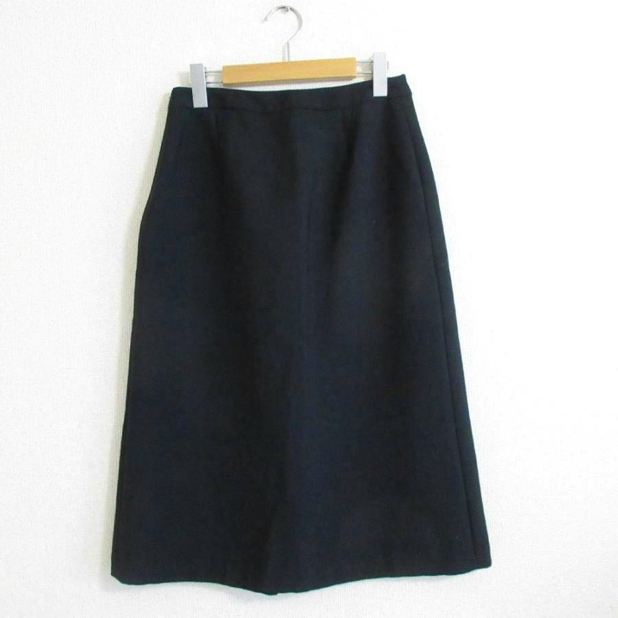 Black A-line midi-length women's skirt hanging on a hanger against a plain white background.